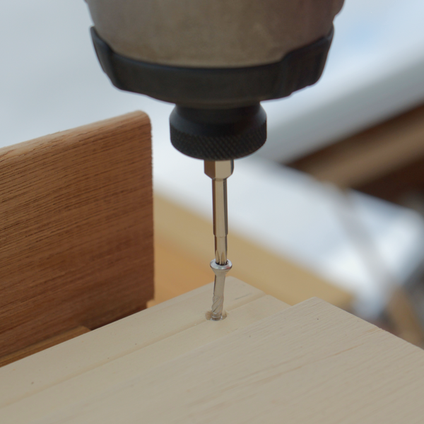 Drilling F-BohrFix screw into cladding