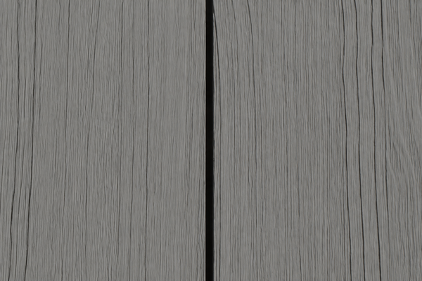 A close-up texture of gray wood grain with a vertical black seam running down the center.